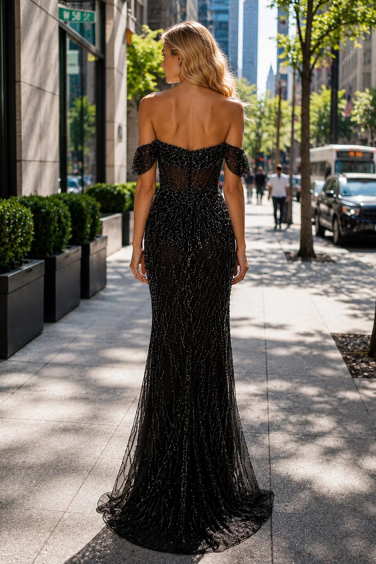 Back view of this Black prom and evening dress highlights the fitted back and flowing hem.