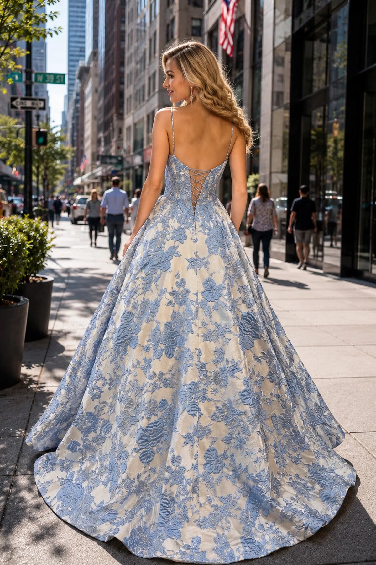 Back view of this Blue prom and evening dress highlights the fitted back and flowing hem.
