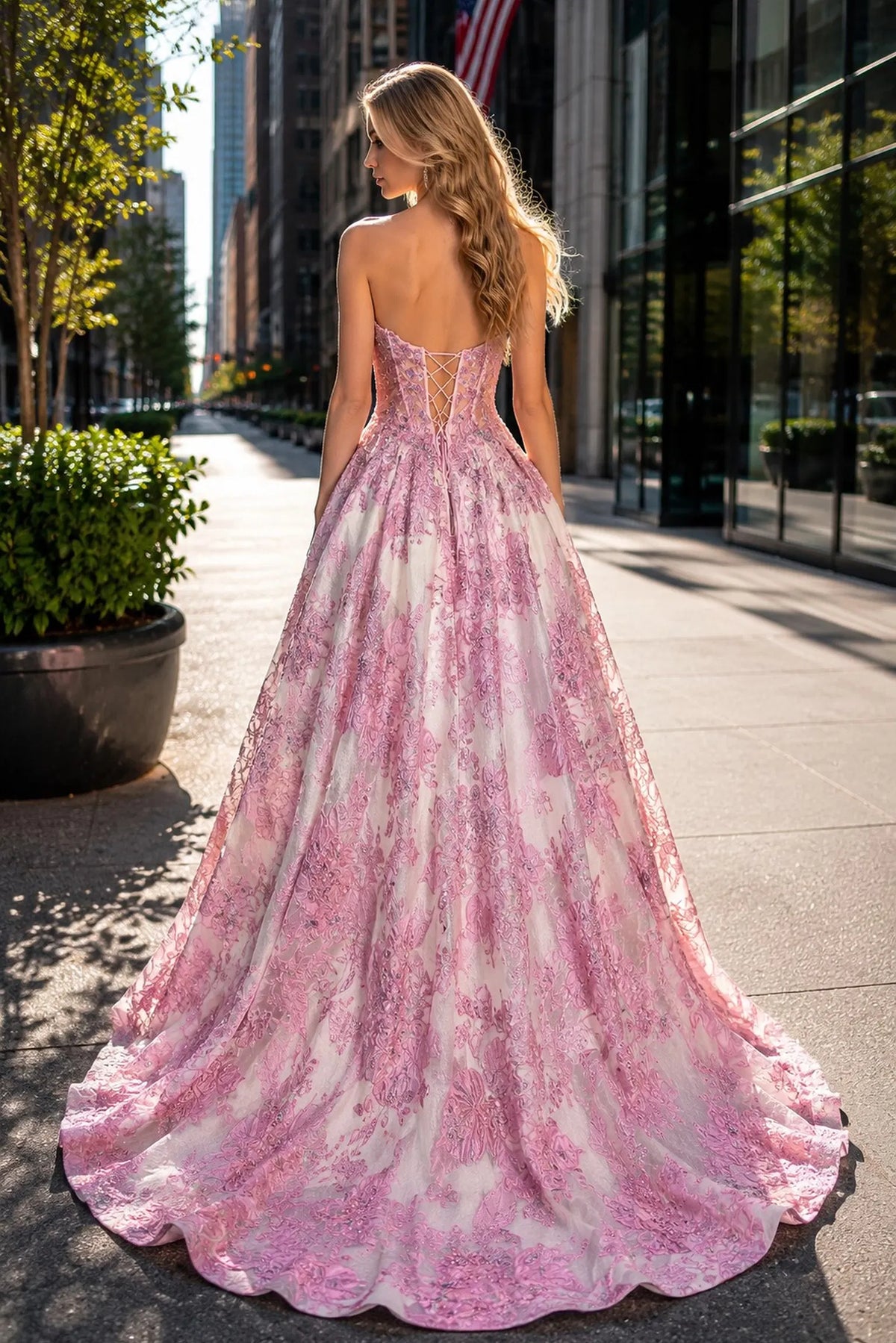 Back view of this Pink prom and evening dress highlights the fitted back and flowing hem.