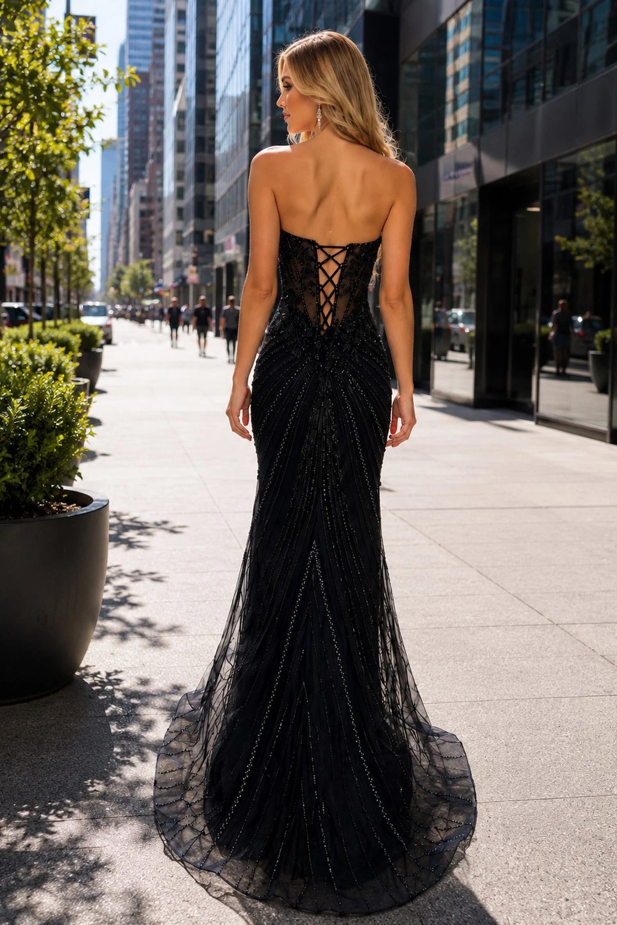 Back view of this Black prom and evening dress highlights the lace-up back.