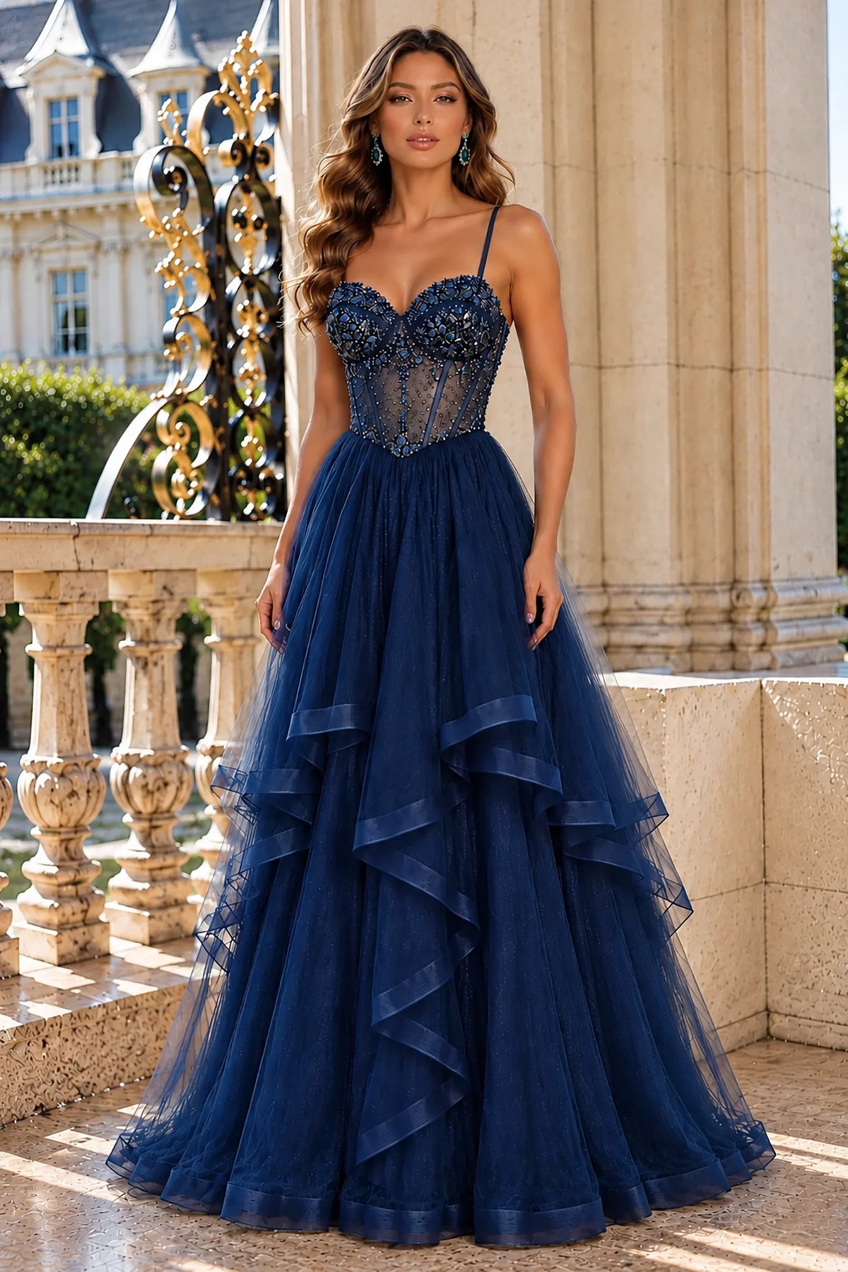 Sweetheart beadwork highlights this Navy prom and evening dress above its tiered tulle skirt.