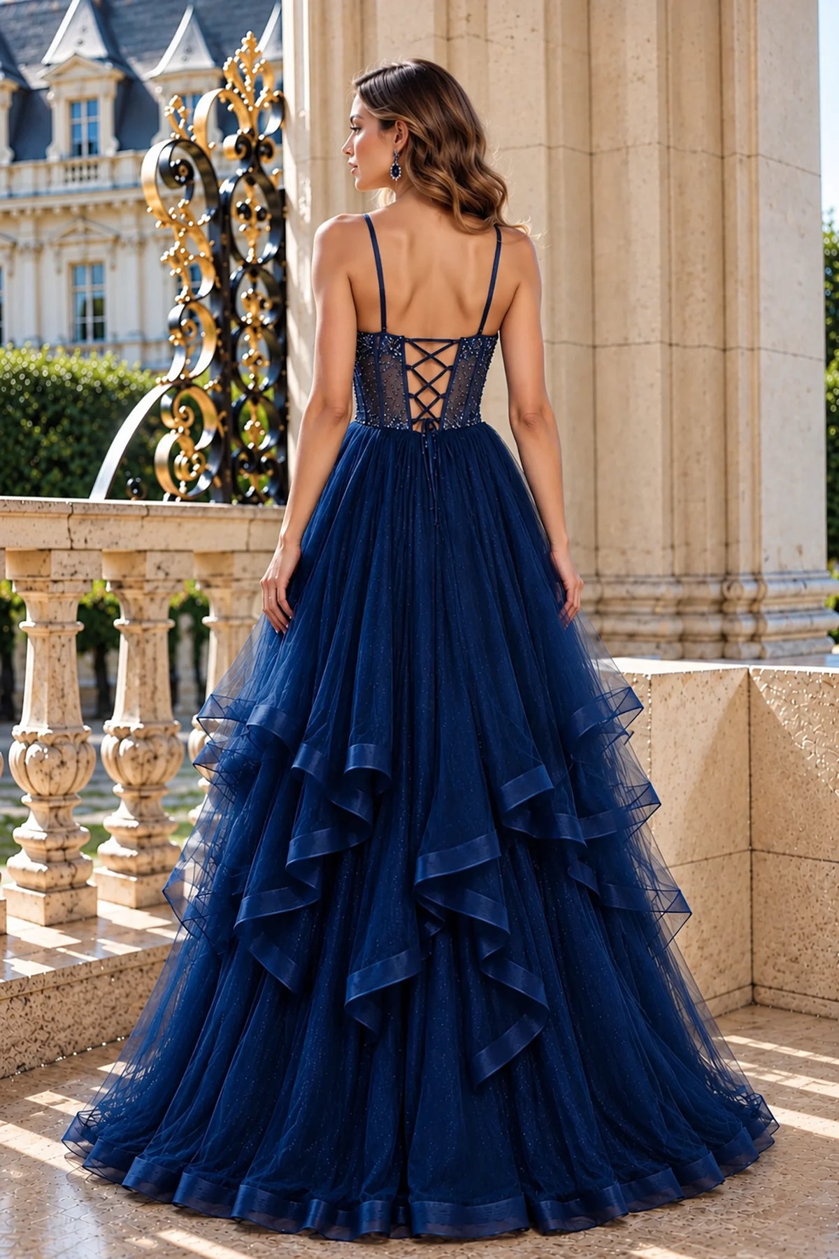 Lace-up detailing completes the back of this Navy prom and evening dress with cascading tulle ruffles.