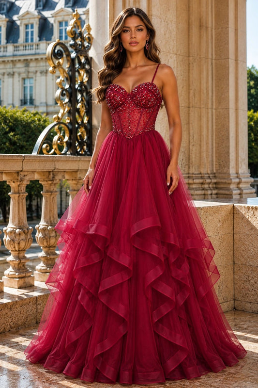 Shown in a front view, the Wine prom and evening dress has beaded sweetheart bodice and tiered tulle ball skirt.