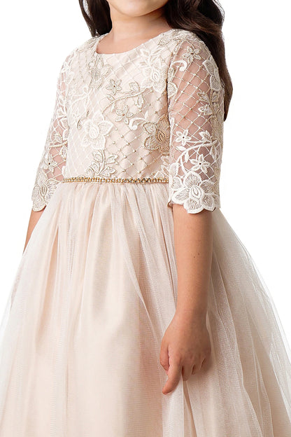 champagne lace dress worn by a child on a white background
