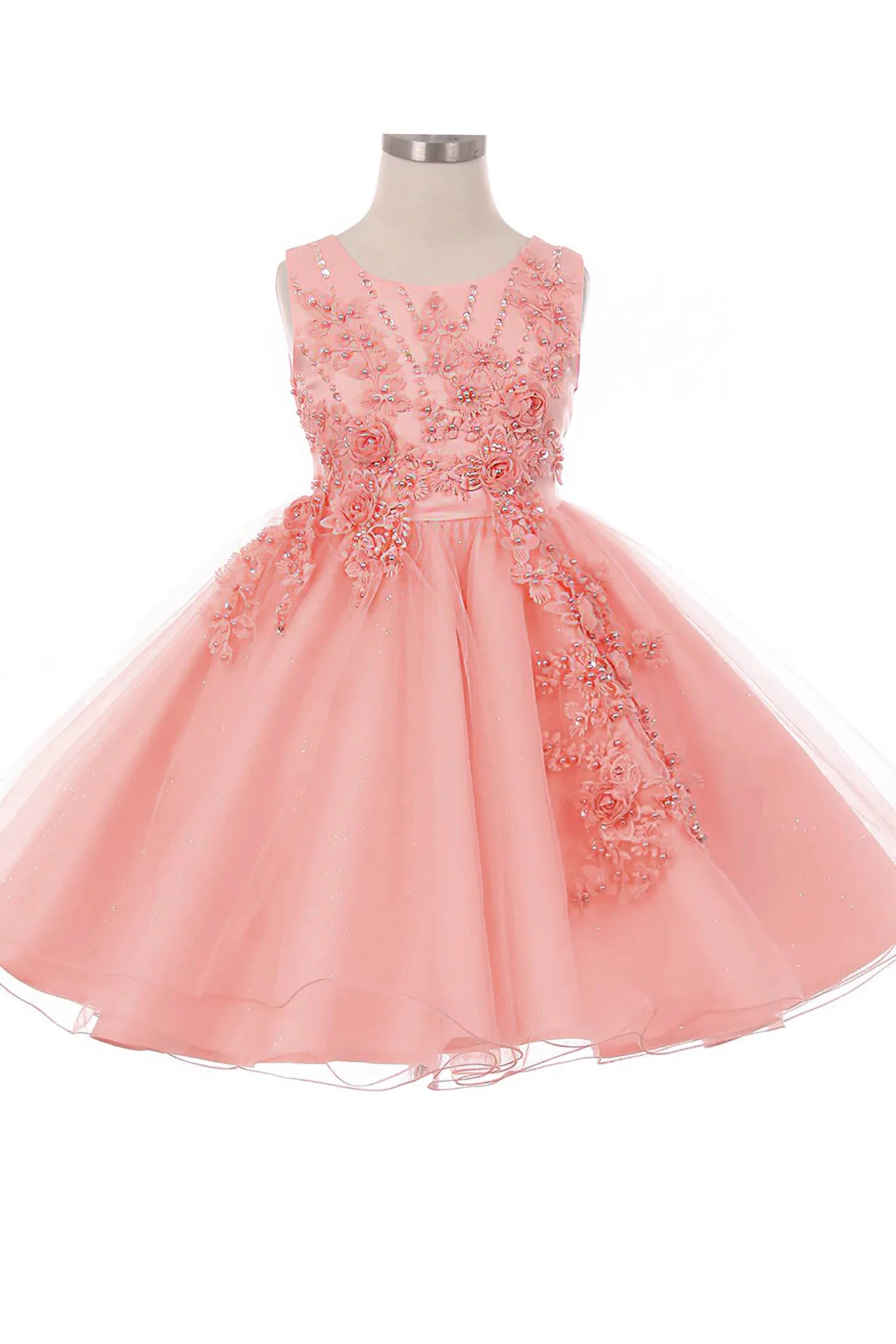Front-facing in peach blush glitter tulle flower girl dress with 3D pearl-beaded floral appliqué bodice and layered skirt.