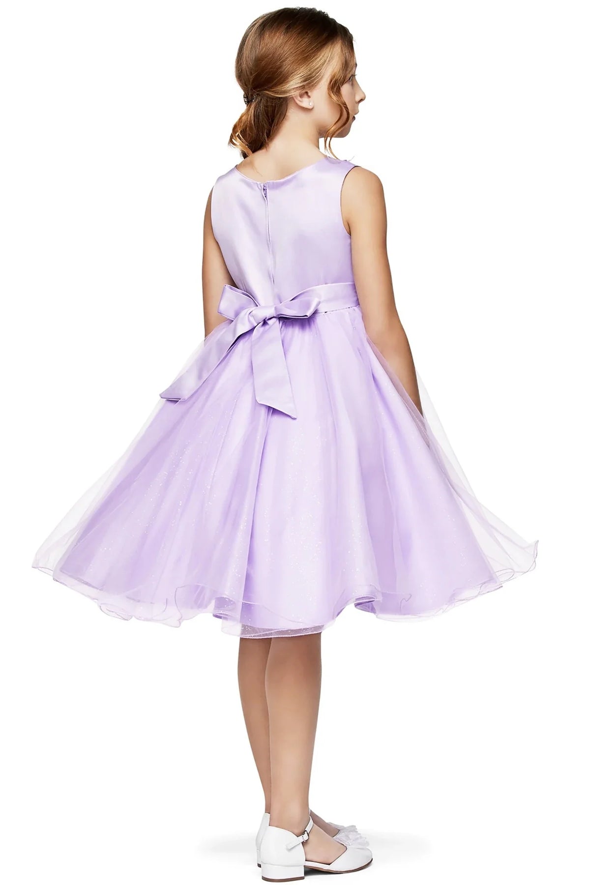 A lilac flower girl dress with a bow.