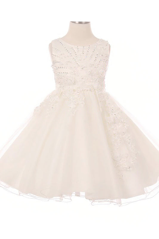 Young girl standing front-facing in ivory glitter tulle flower girl dress with 3D pearl-beaded floral appliqué bodice and layered skirt