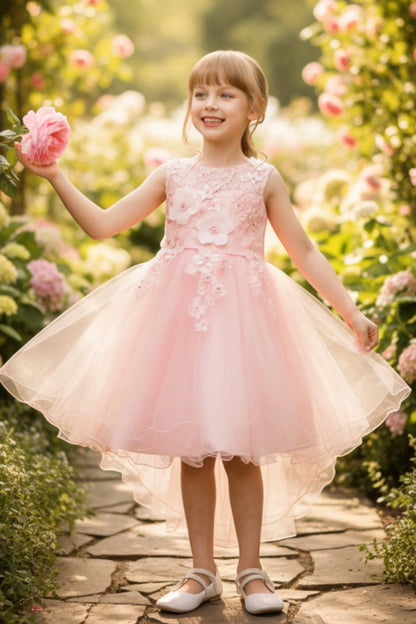 Featuring floral appliques beside a layered tulle skirt on the Blush flower girl dress.