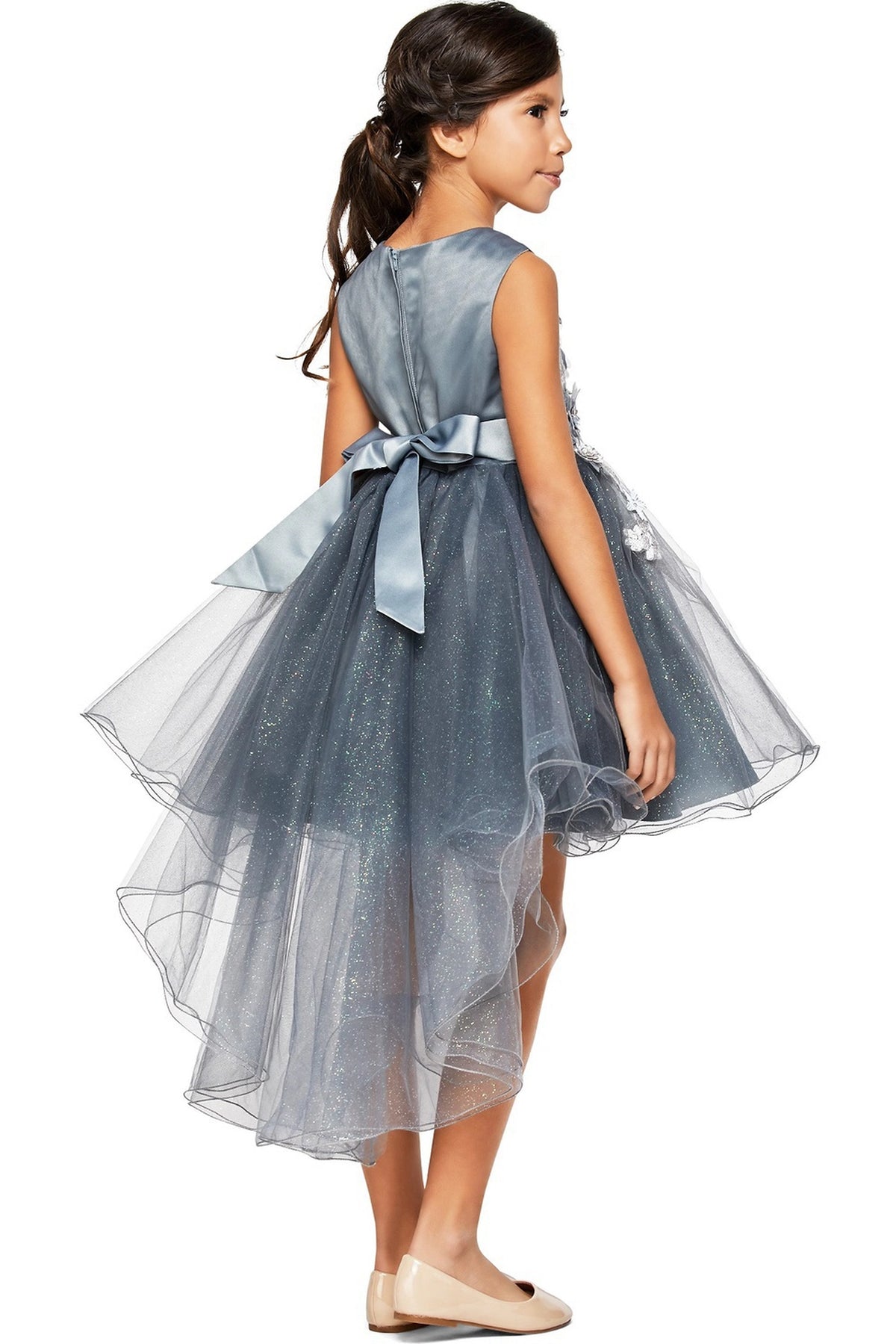A Silver flower girl dress showing back bow and layered high-low tulle hem.