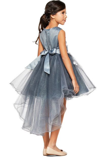 A Silver flower girl dress showing back bow and layered high-low tulle hem.