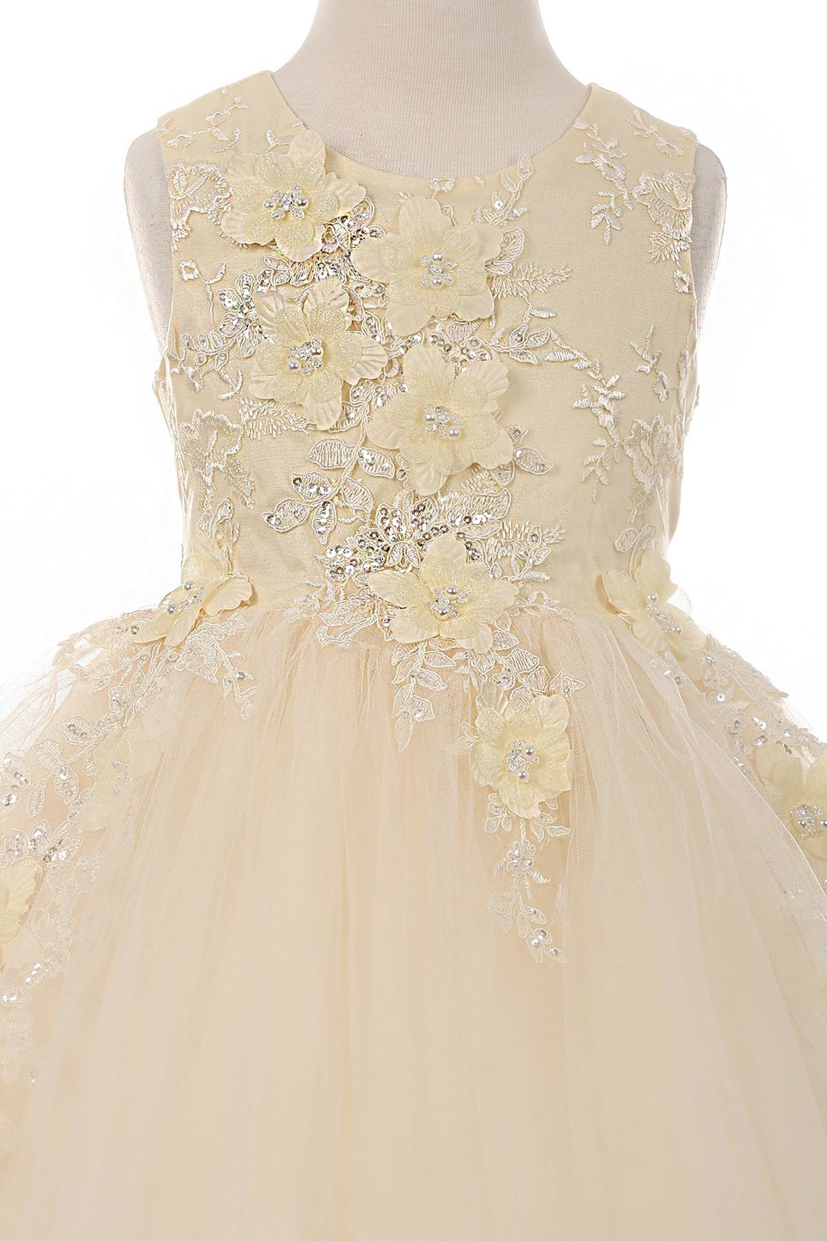 Champagne flower girl dress with floral lace details.