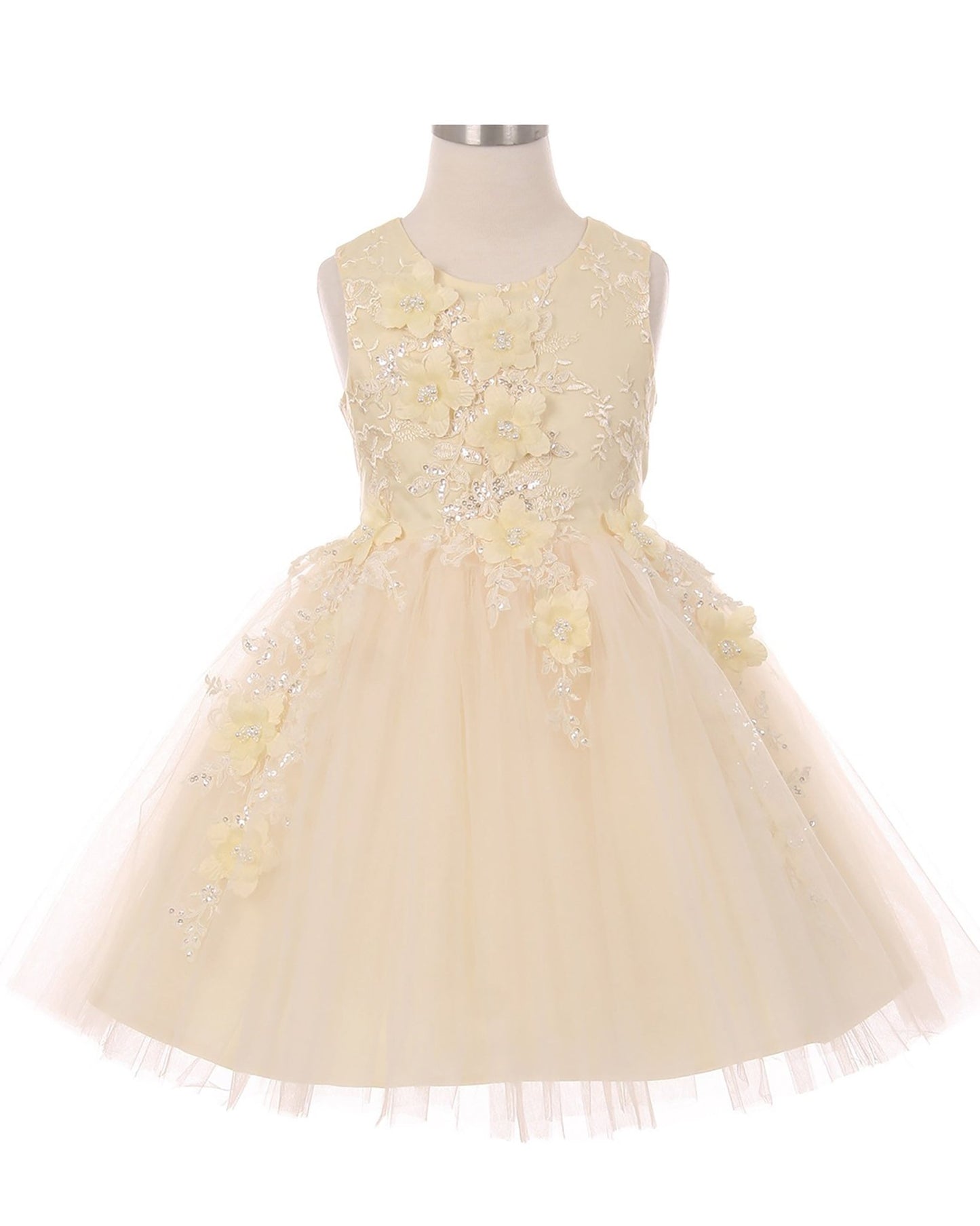Champagne flower girl dress with floral embellishments.