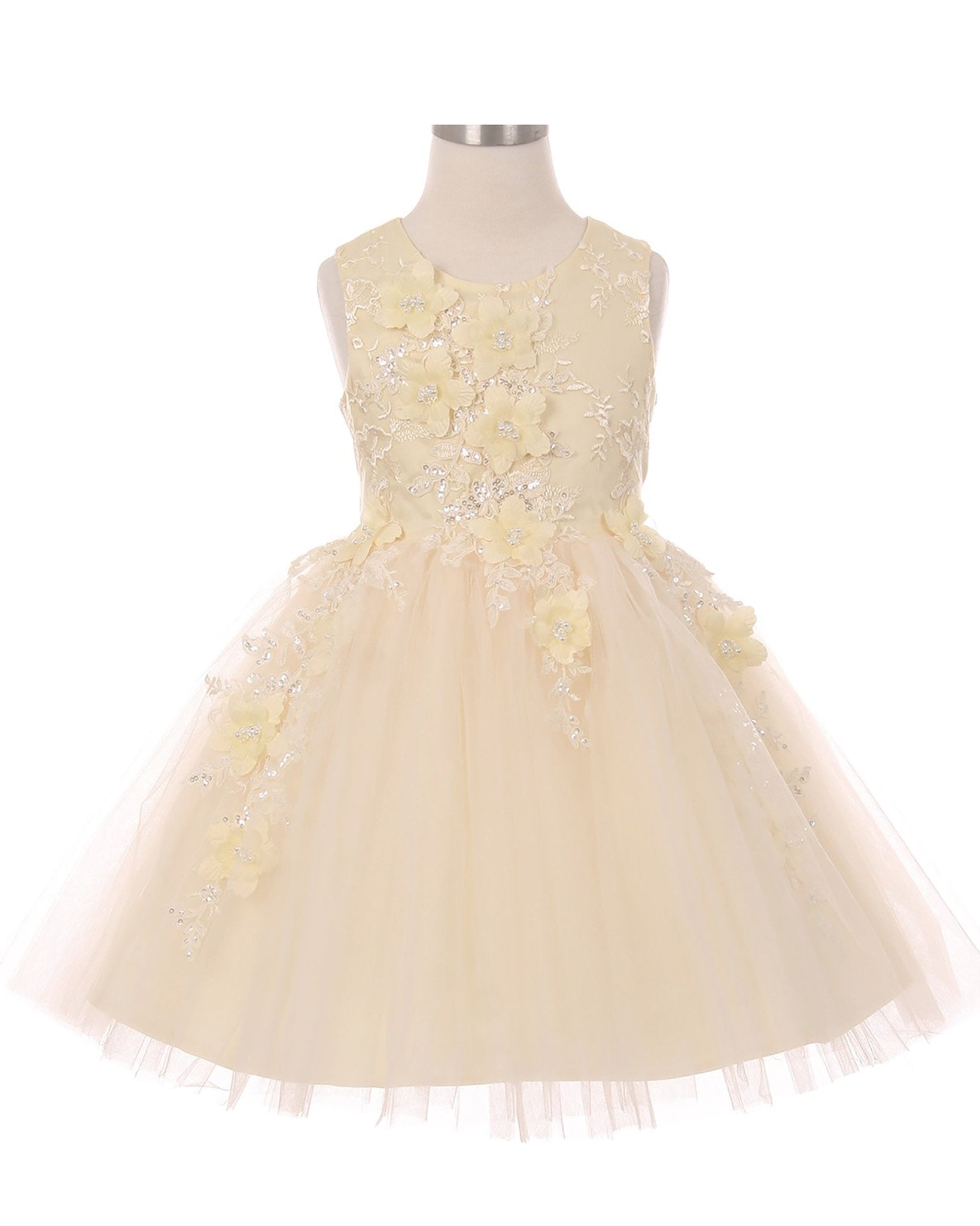 Champagne flower girl dress with floral embellishments.