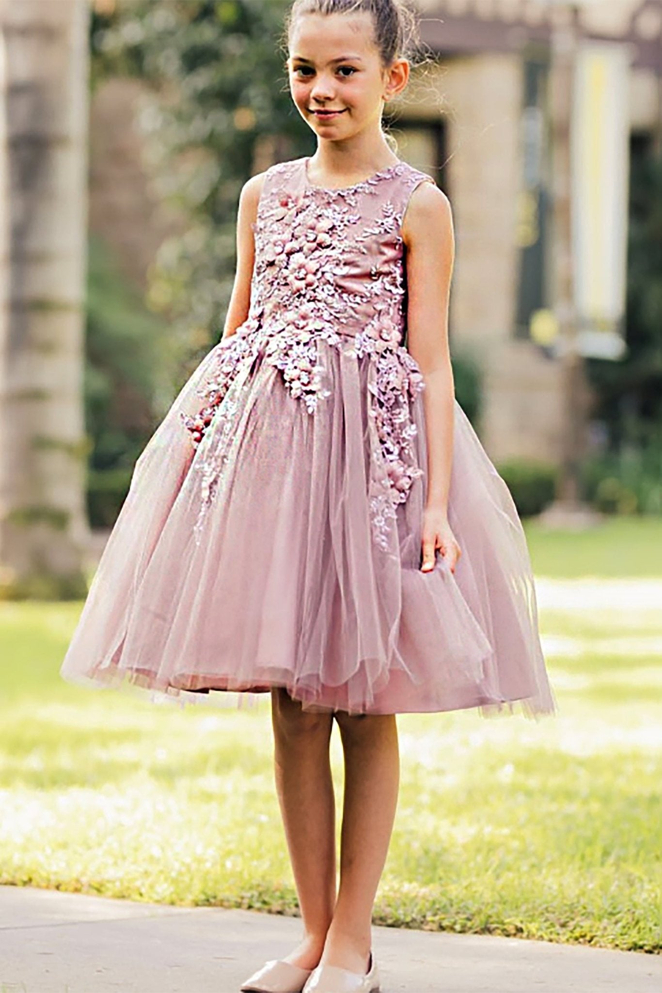 A pink floral flower girl dress.