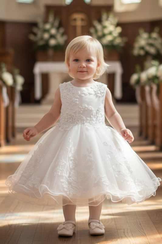 Kid Wearing White Flower Girl Dress Front View With Illusion Bodice And Wired Tulle Skirt
