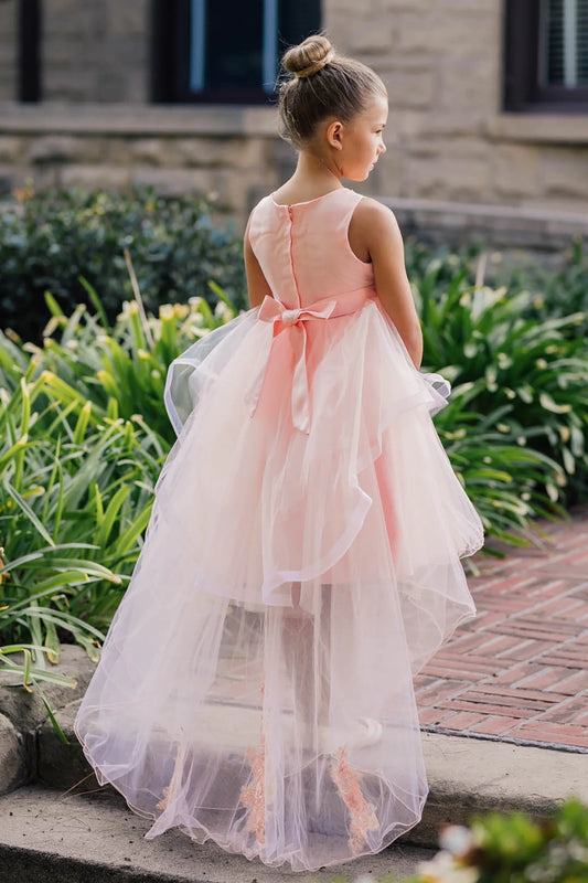 A pink floral flower girl dress.