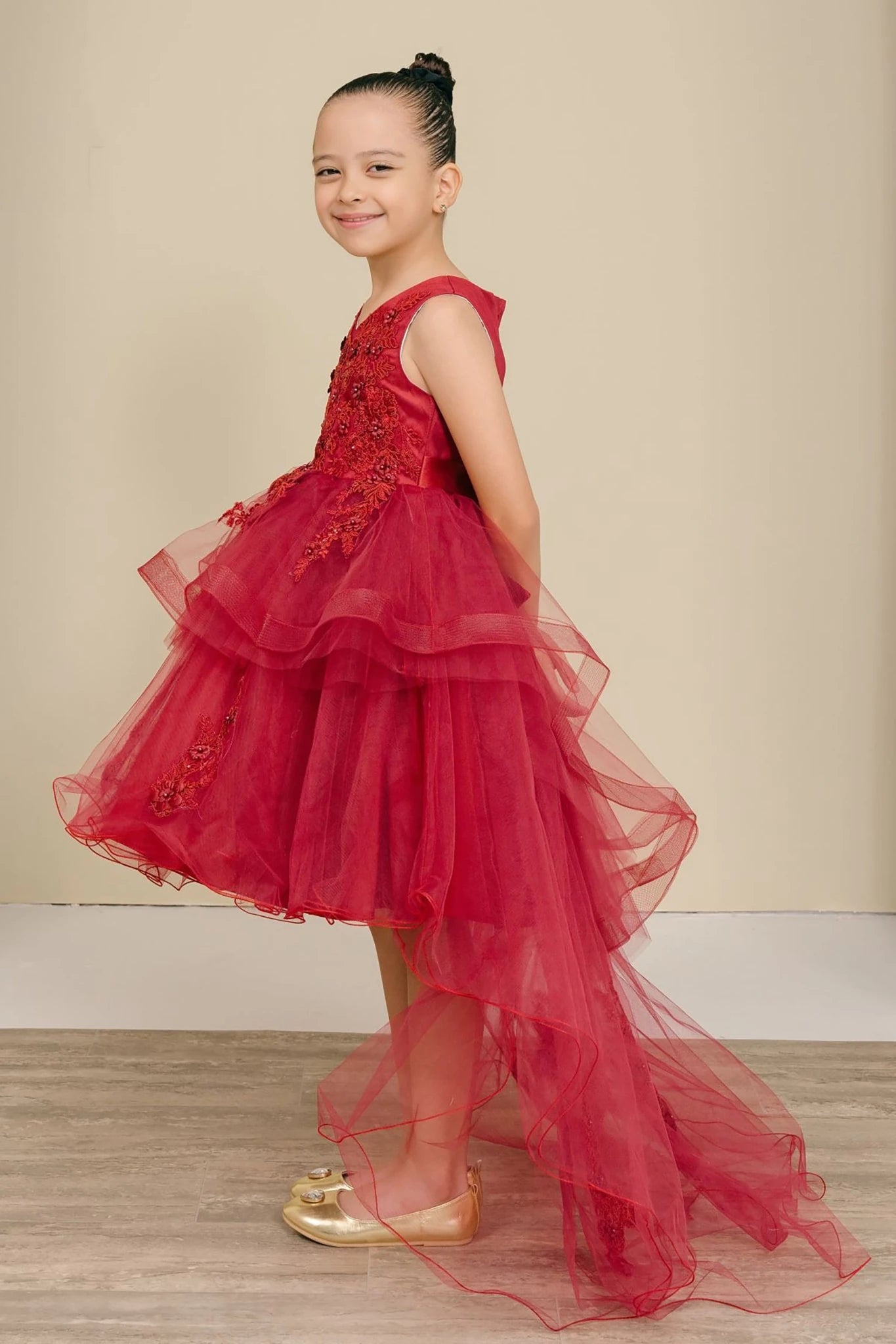 A burgundy flower girl dress with floral details.