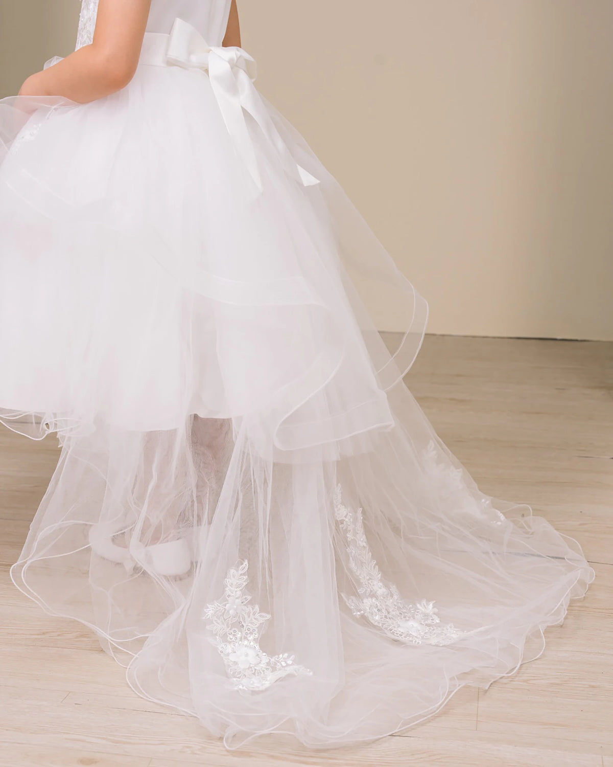 White flower girl dress with lace details.