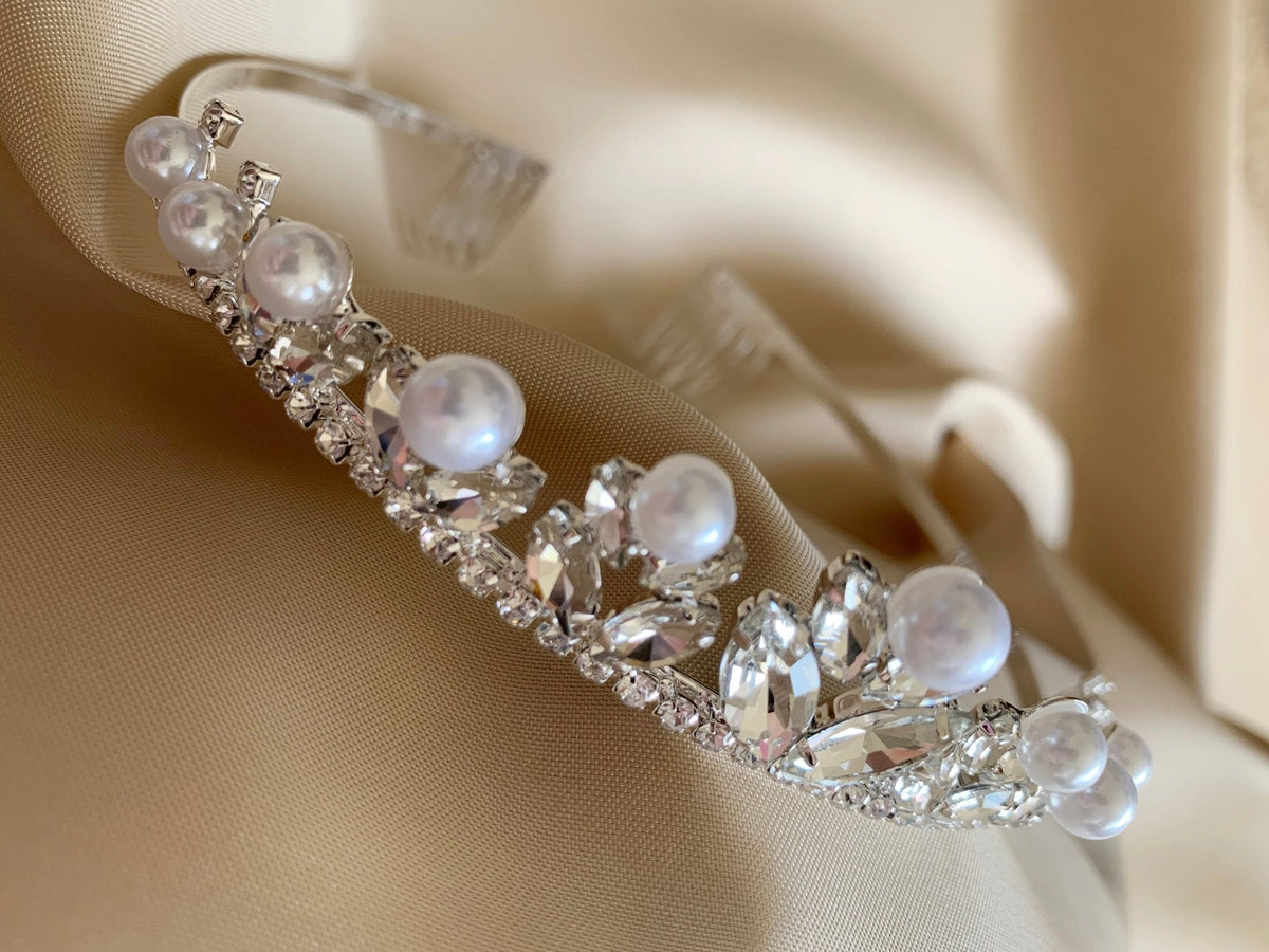 Clear pearl rhinestone flower girl and mini quince tiara, close-up, embellishment detail.