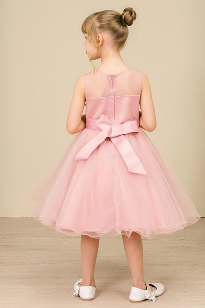 A Dusty Rose flower girl dress showing back bow and sheer neckline.