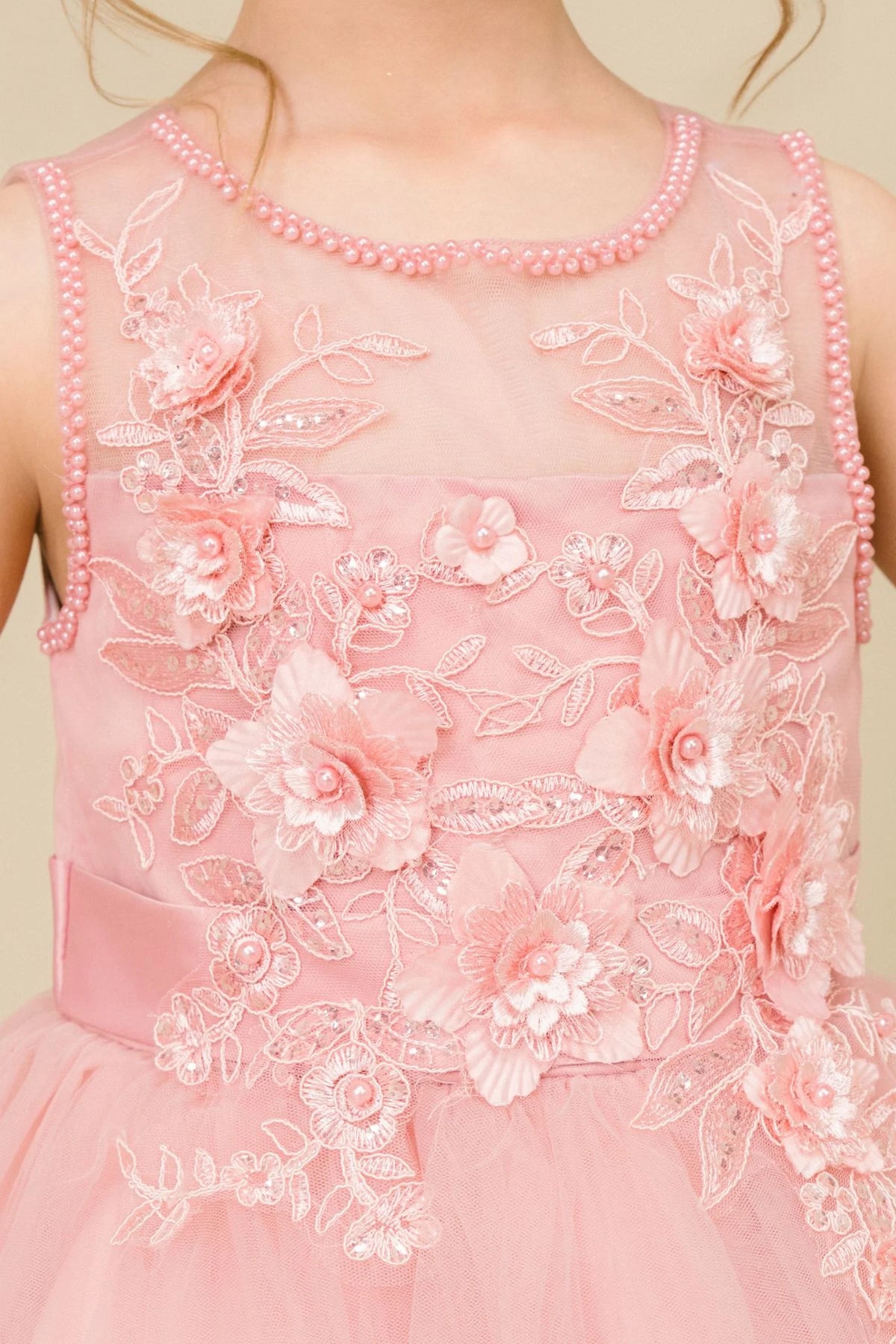 Visible on this Dusty Rose flower girl dress: raised floral embroidery across the bodice.