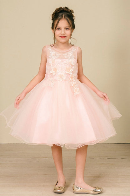 Peach flower girl dress features flower appliques and a flared tulle skirt.