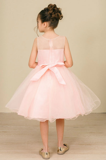A Peach flower girl dress showing satin bow below the sheer back yoke.