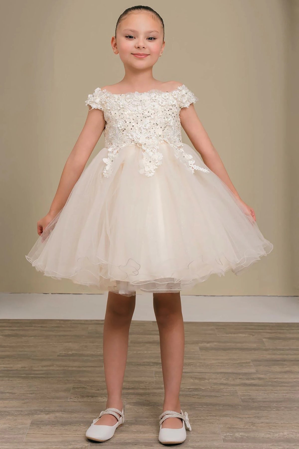 A champagne lace flower girl dress.
