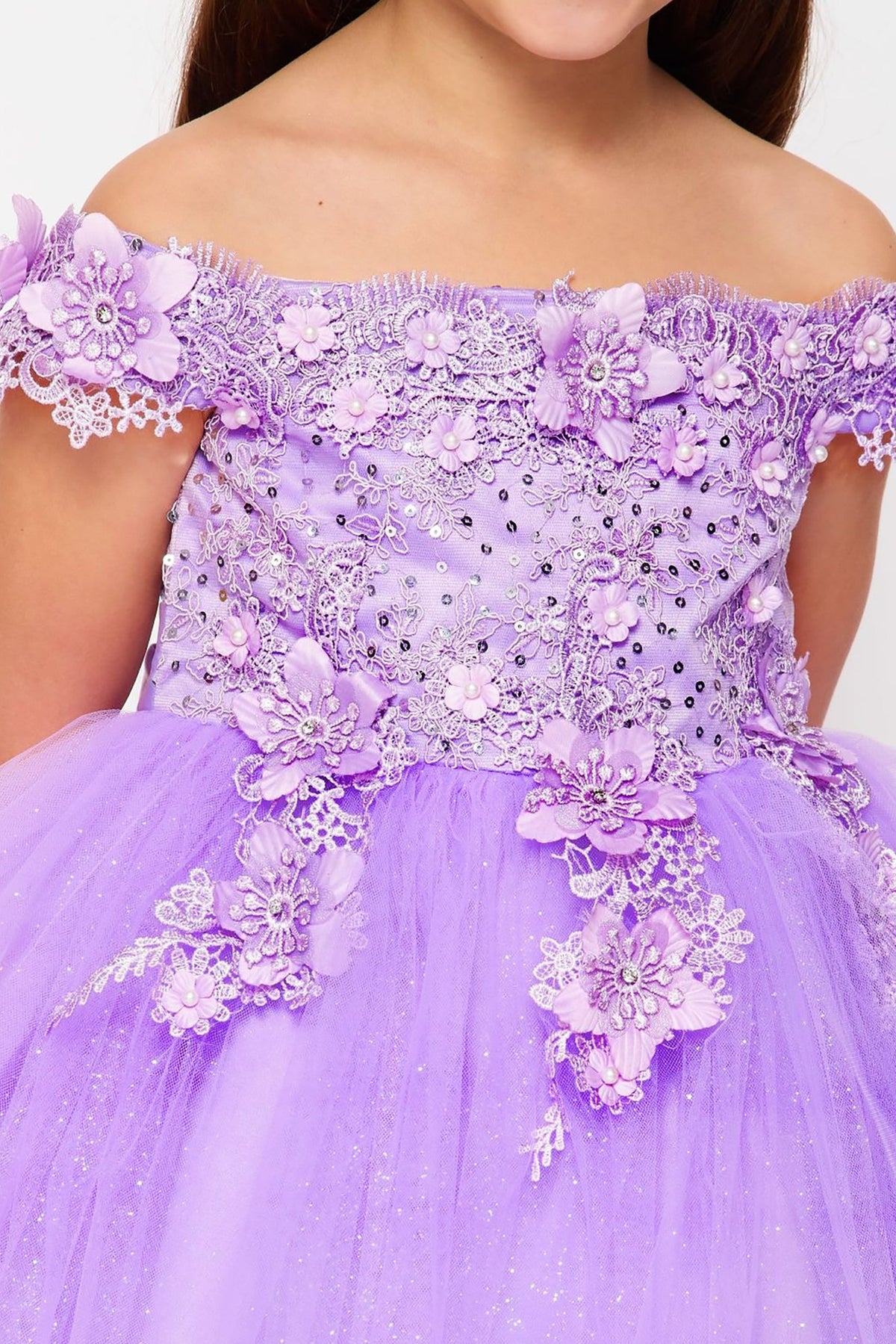 lilac off-shoulder flower girl dress with floral embellishments.