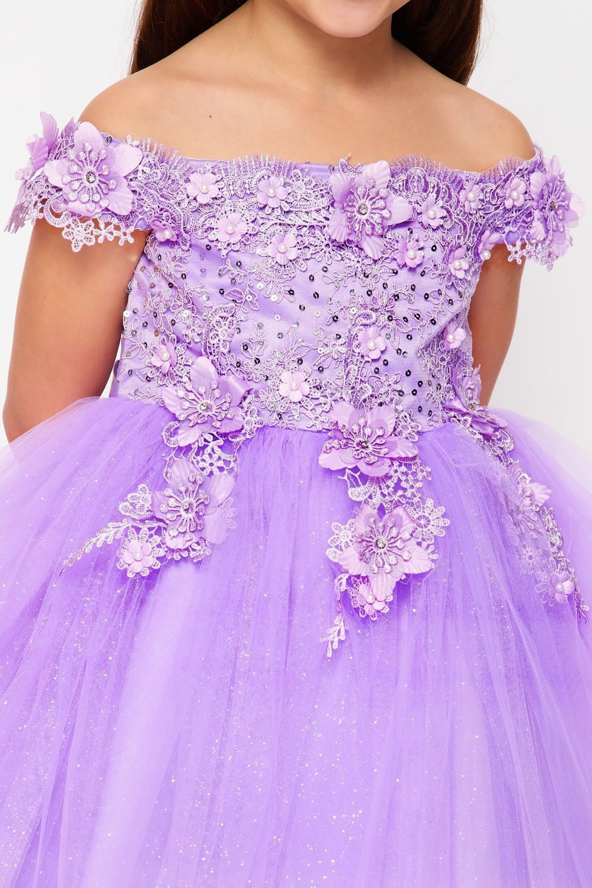 Lavender off-shoulder flower girl dress with floral embellishments.