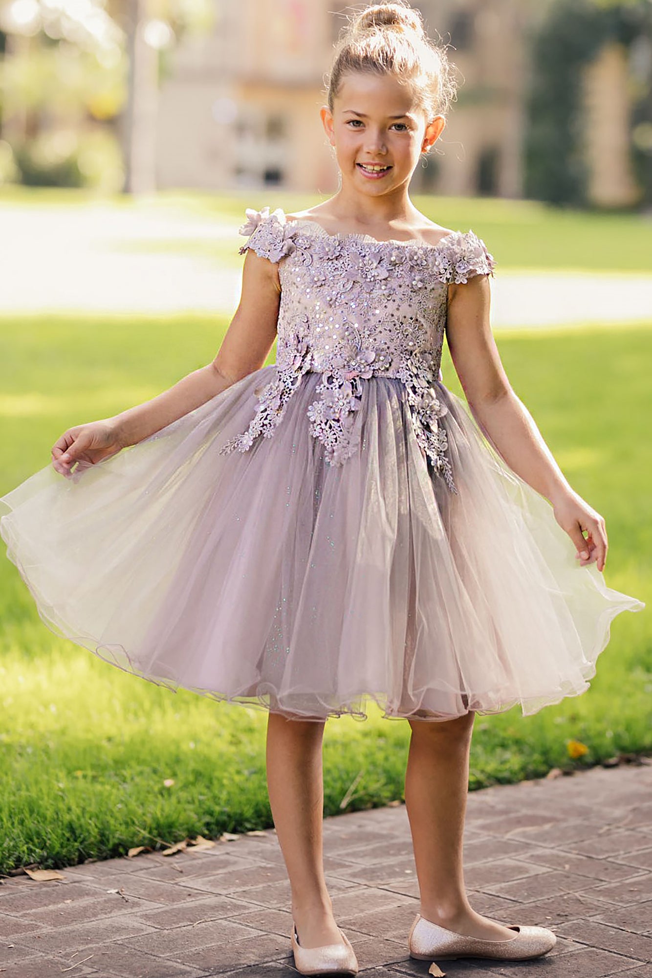 Front view of mauve off-the-shoulder flower girl dress with 3D floral appliqué bodice, rhinestone embellishments, and glitter tulle layered skirt.
