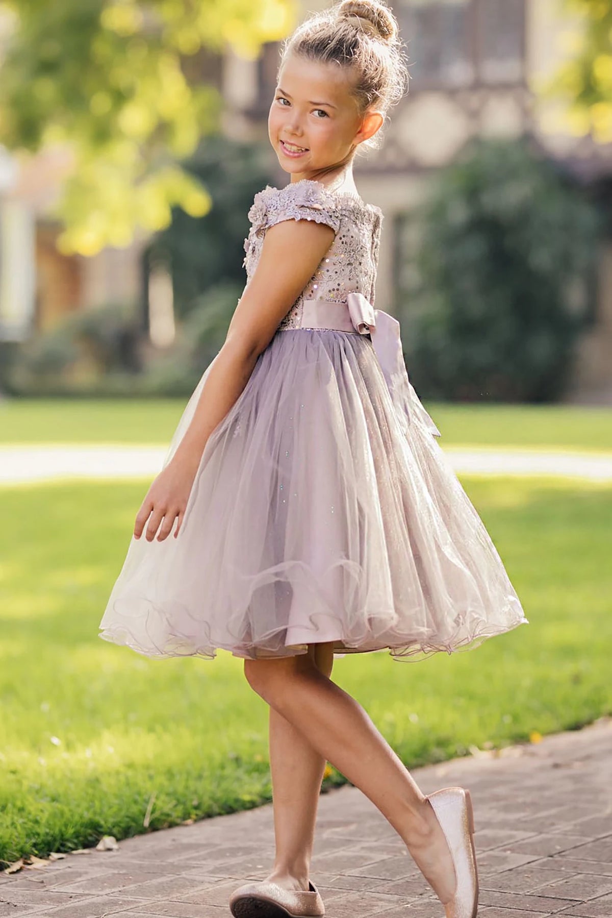 A light mauve flower girl dress.