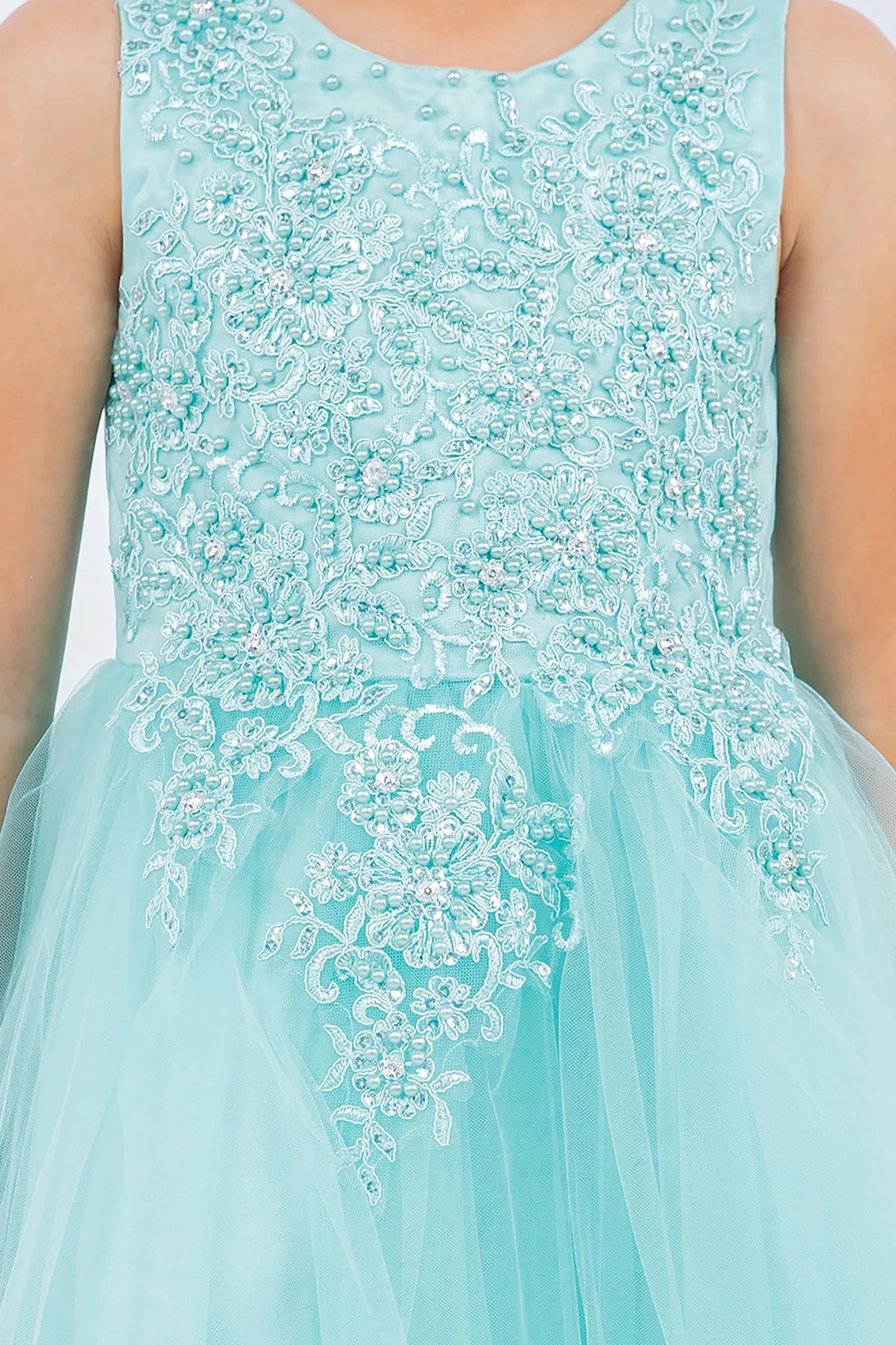Close-up front-facing view of aqua blue sleeveless high-low tulle flower girl dress with lace bodice, pearl trim neckline, and rhinestone detailing.