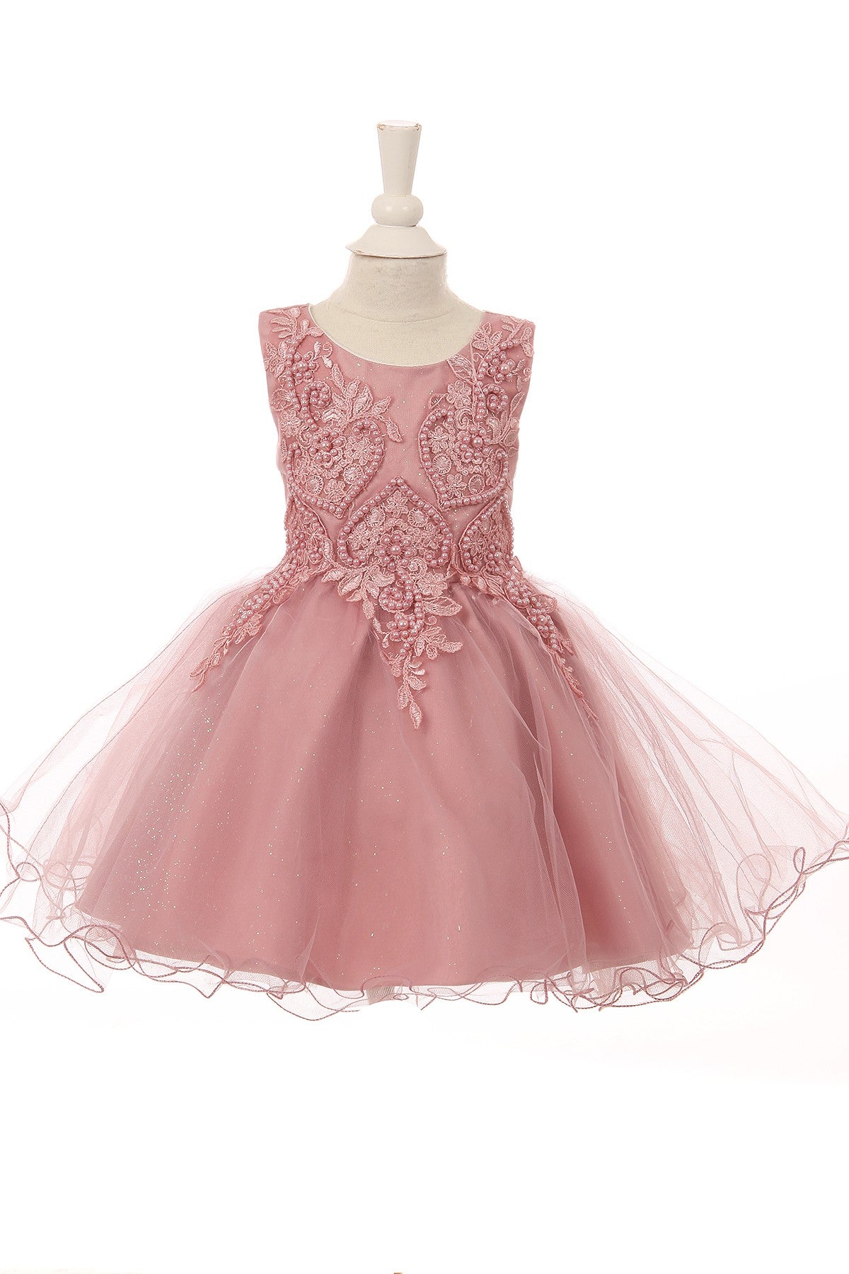 Dusty rose flower girl dress back view highlighting flowing tulle skirt and elegant silhouette.