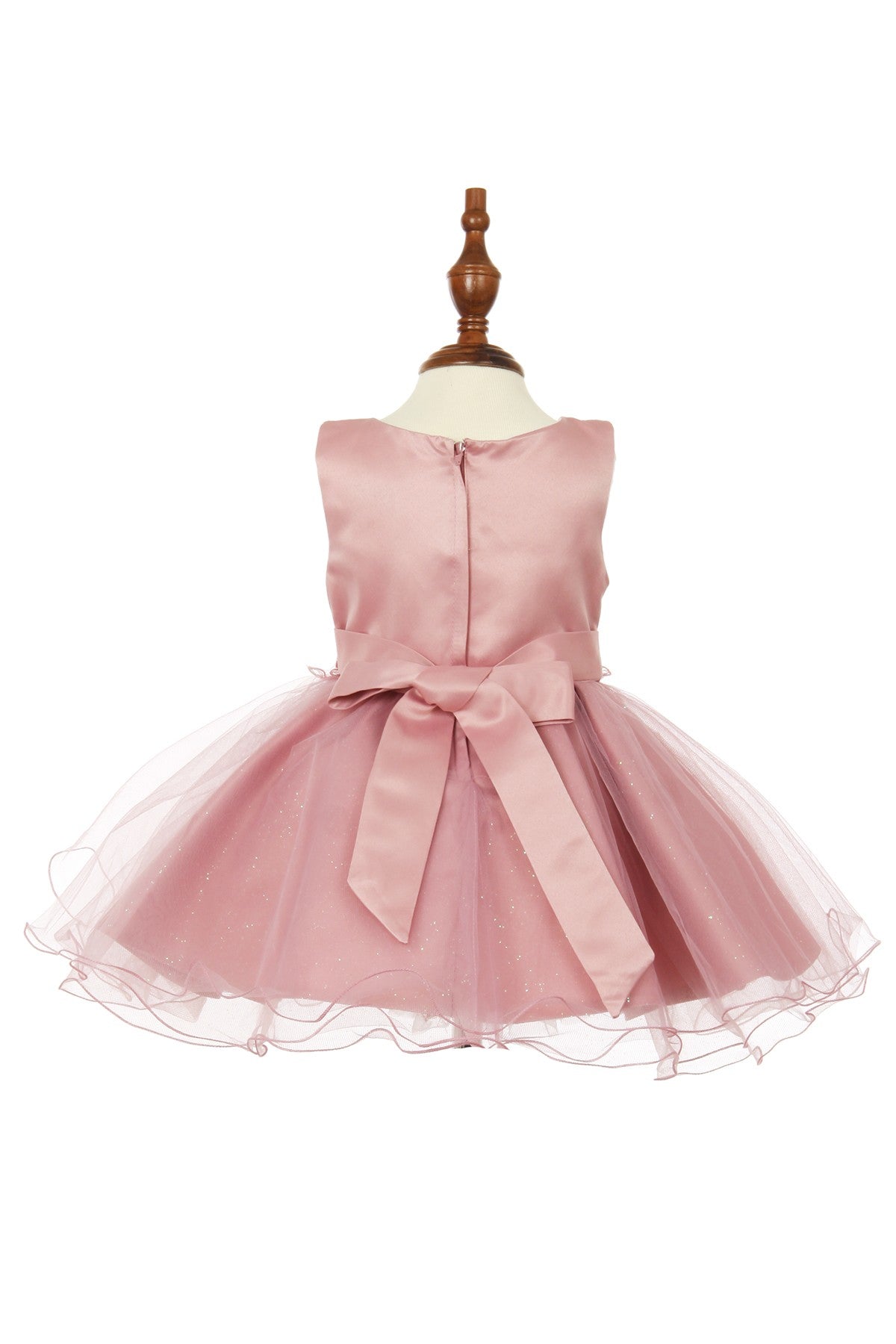 Rose flower girl dress back view highlighting flowing tulle skirt and elegant silhouette.
