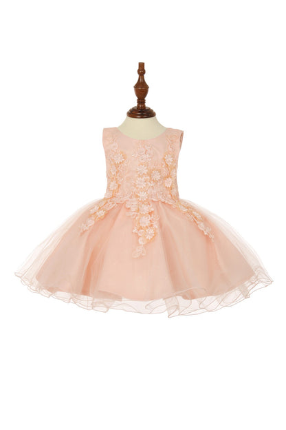 Close-up front view of blush dress showing bodice detail and soft tulle texture