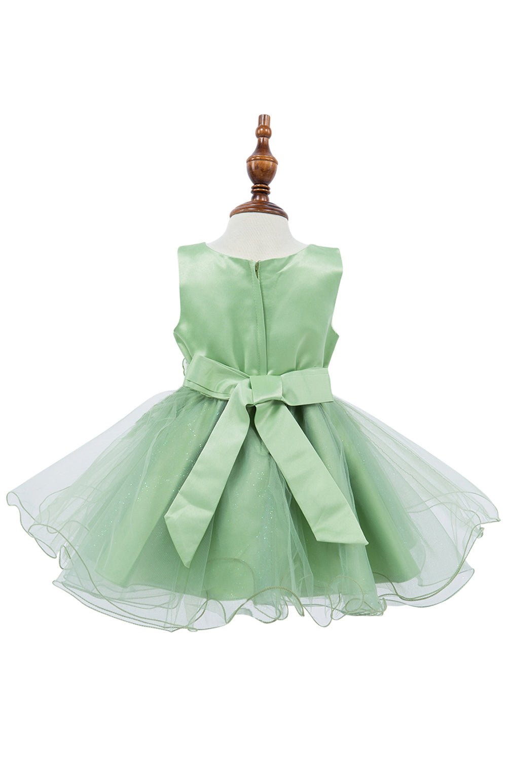 Sage flower girl dress back view highlighting voluminous skirt and elegant silhouette.