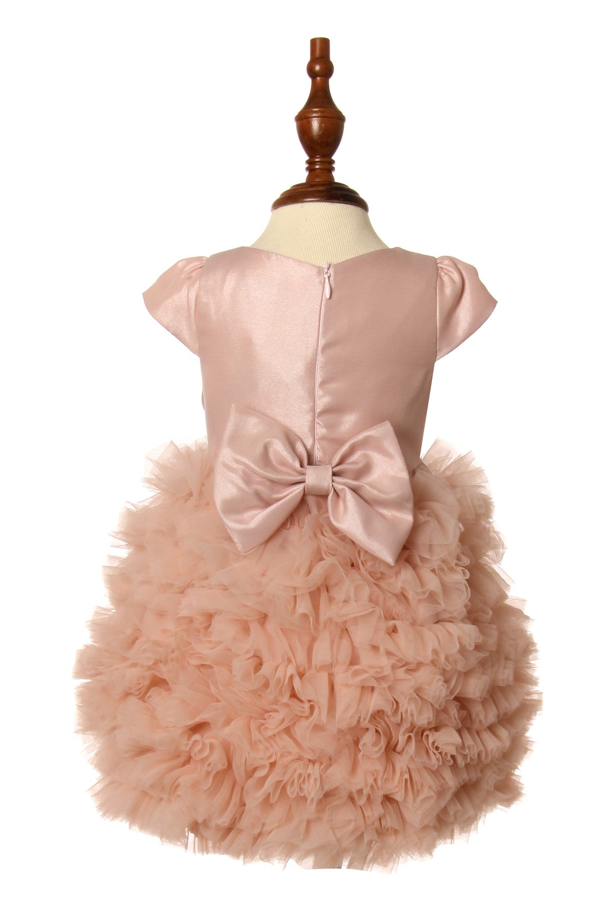 Dusty rose flower girl dress back view highlighting voluminous skirt and elegant silhouette.