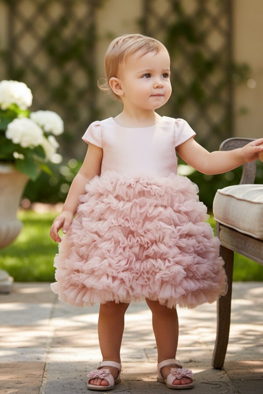 Dusty Rose flower girl Dress Front View With Cap Sleeves And Layered Tulle Skirt.