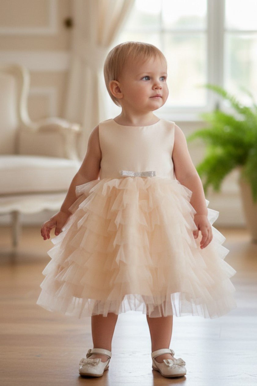 Champagne flower girl Dress Front View With Cap Sleeves And Layered Tulle Skirt.