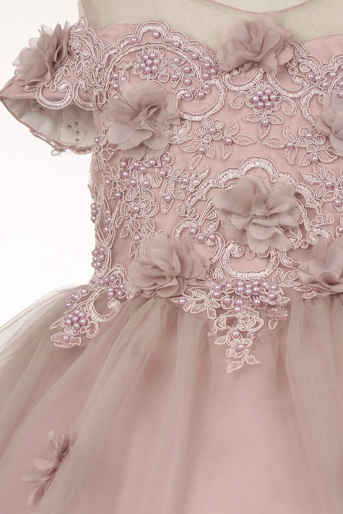 Finished details of dimensional flowers across the bodice distinguish the Mauve kids party dress.