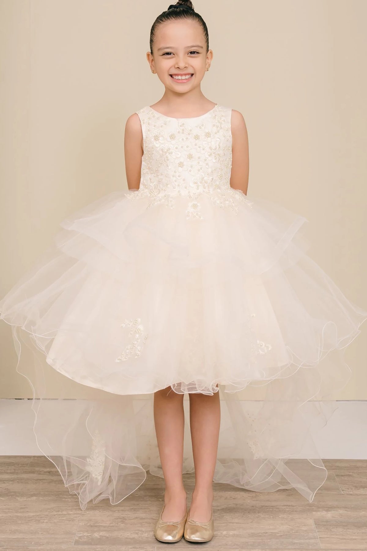 A champagne floral flower girl dress.