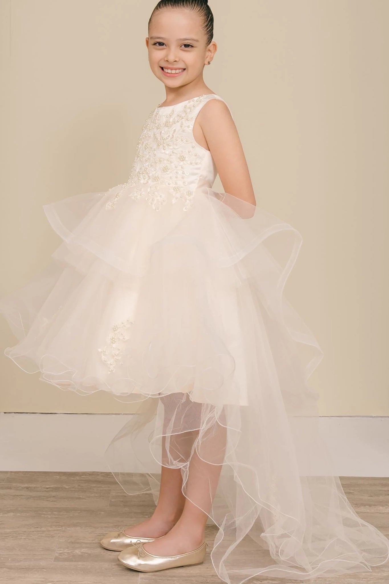 A champagne floral flower girl dress.