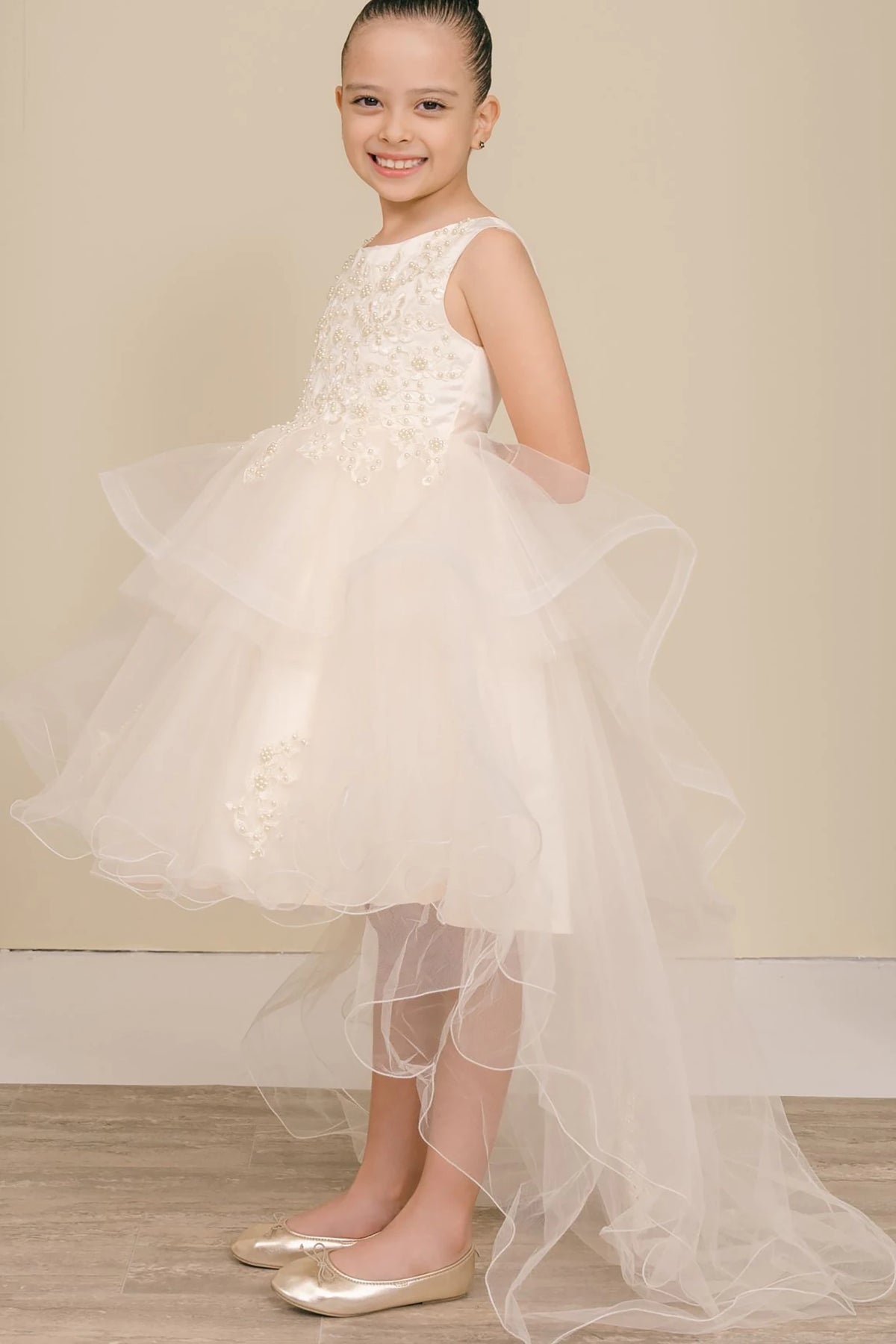A champagne floral flower girl dress.