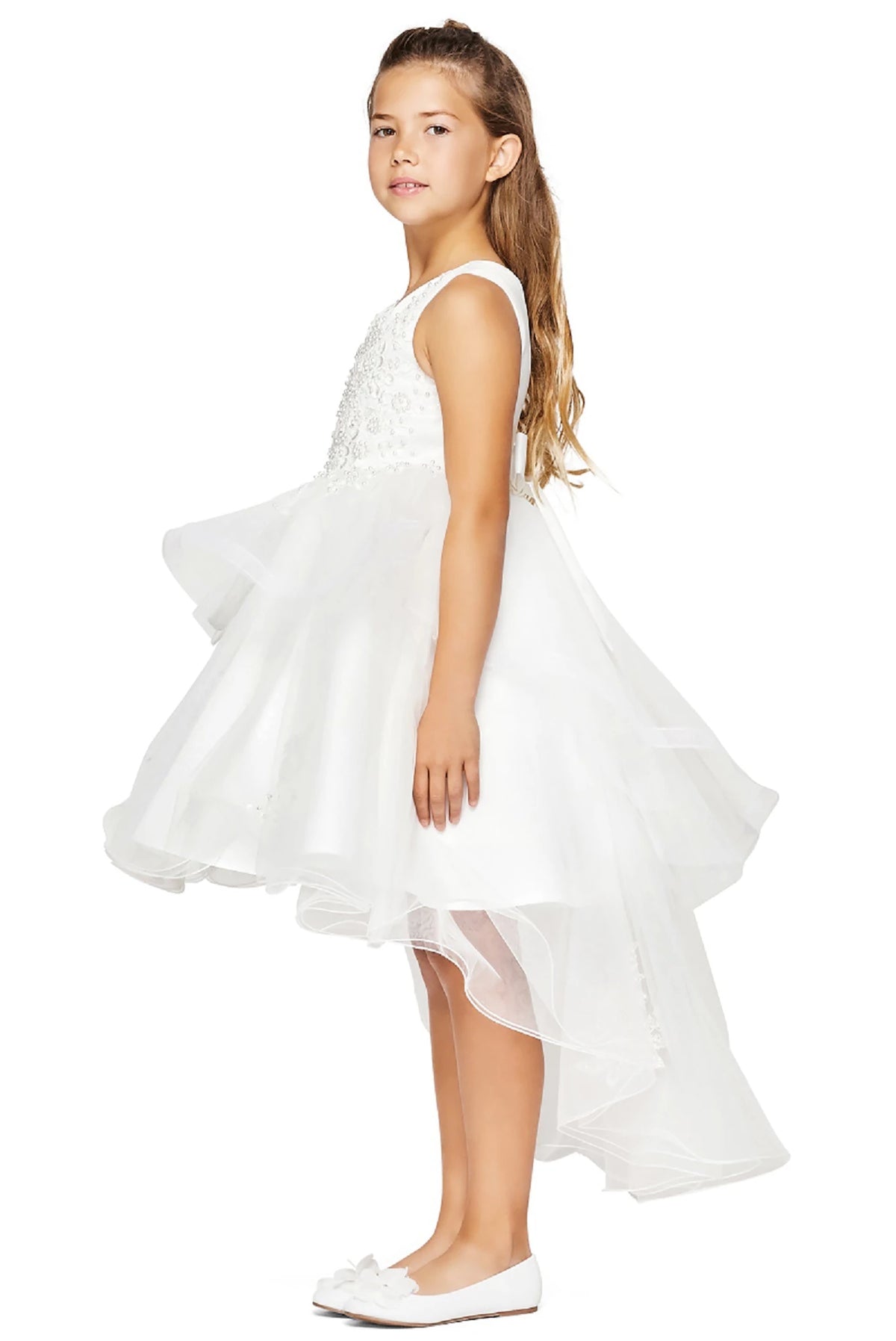 A white flower girl dress with a floral top and ruffled skirt.