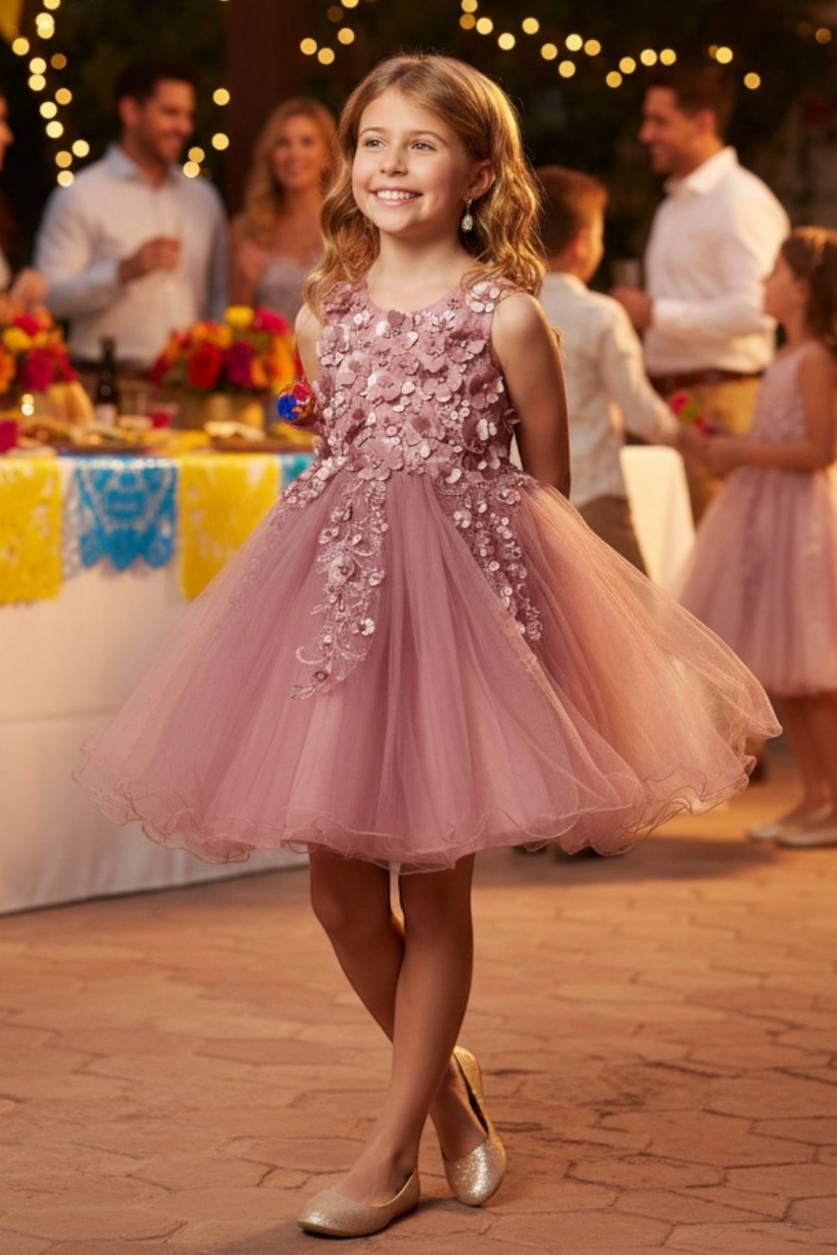 Showcasing with three-dimensional flowers on the bodice, this Mauve kids party dress displays elegant detail.