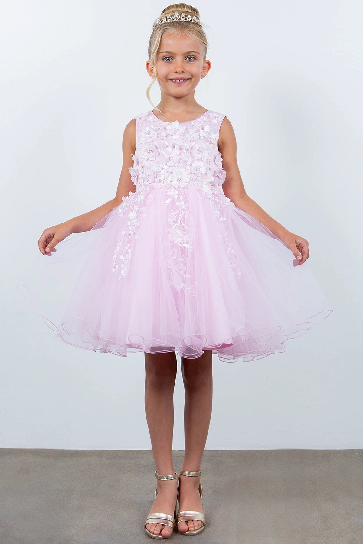 Accented a full tulle skirt adds character to this Pink kids party dress.