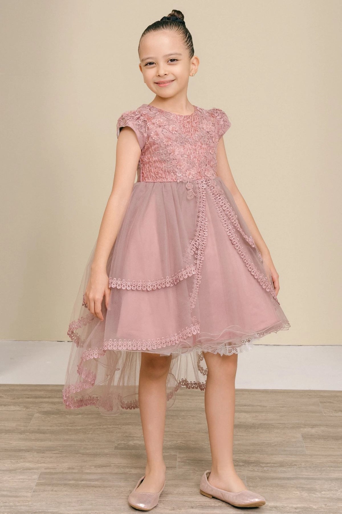 Mauve flower girl dress features lace bodice above layered high-low tulle.