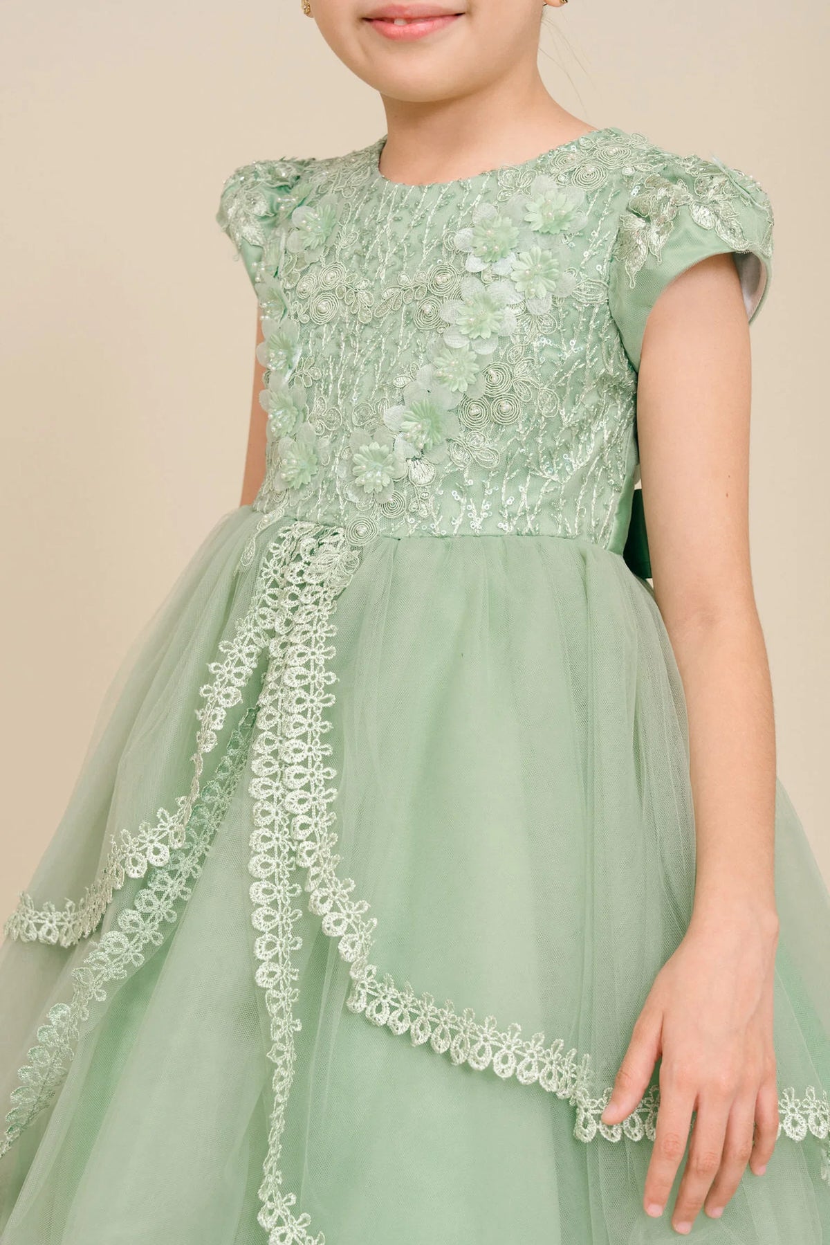 Visible on this Sage flower girl dress: lace bodice with softly capped sleeves.