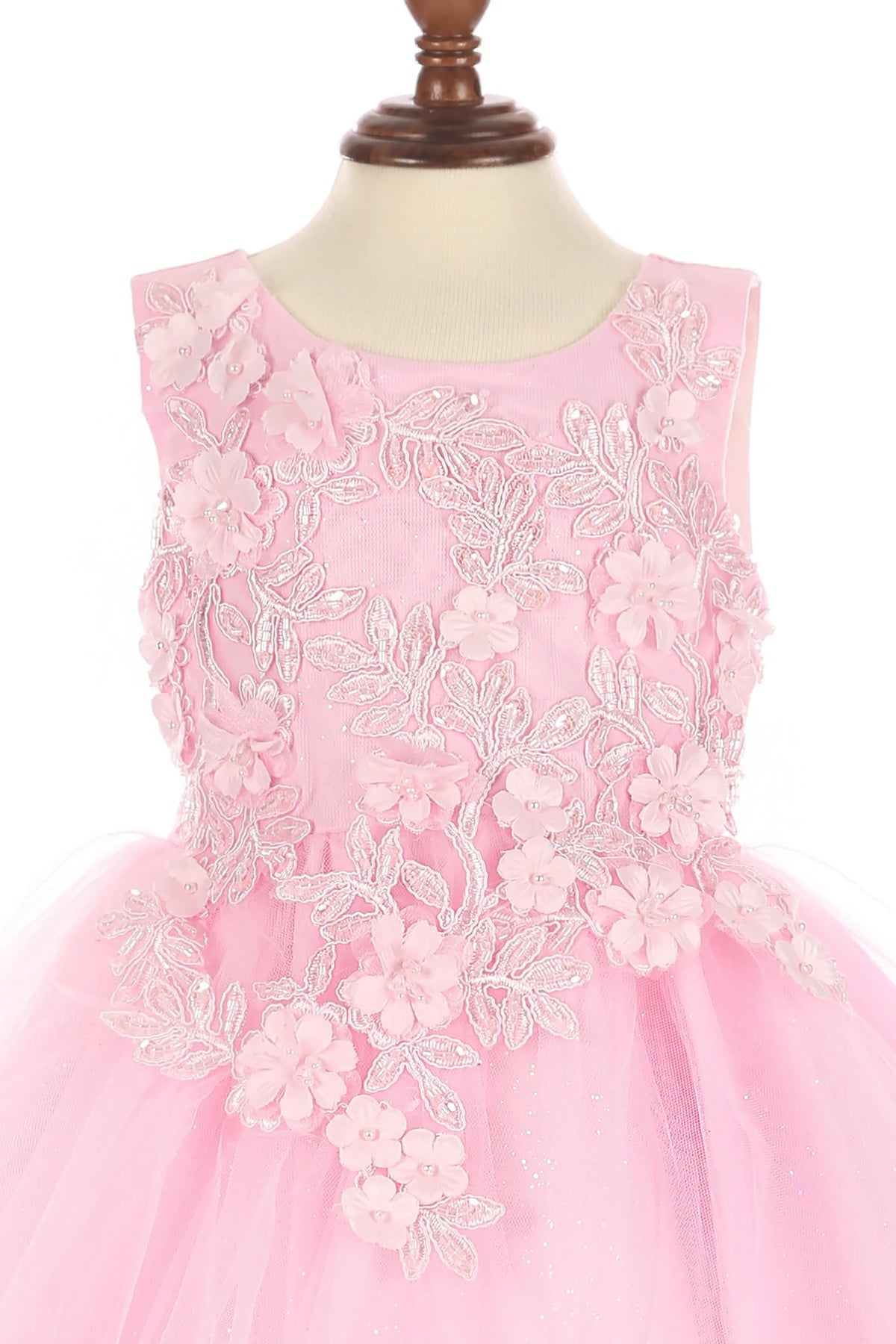 Pink flower girl dress with floral lace details.